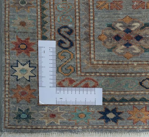 Corner detail of New Kazak rug showing border pattern and Wool pile