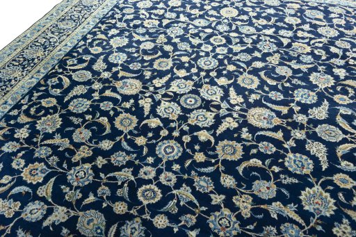 Backside of handmade 2000s Kashan rug showing knot structure and weave density
