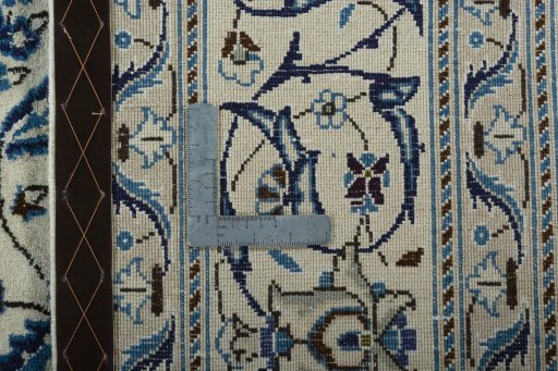 Backside of handmade 2000s Nain rug showing knot structure and weave density