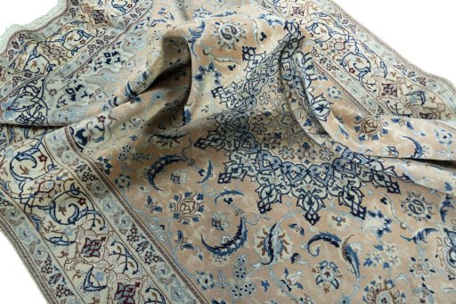 Surface texture of 2000s Nain rug with natural Wool and intricate pattern