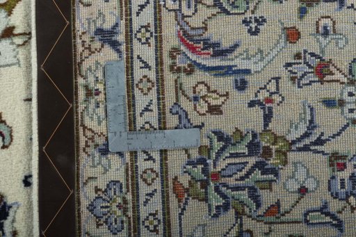 Backside of handmade 2000s Kashan rug showing knot structure and weave density