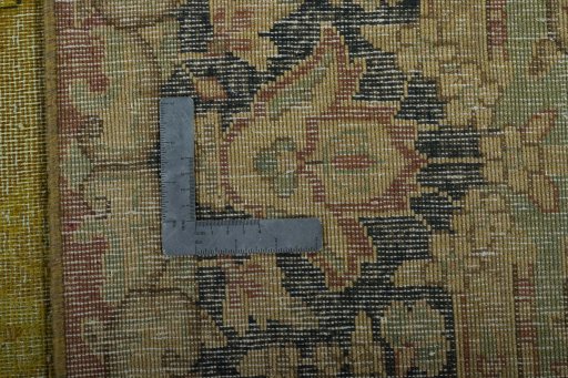 Backside of handmade 1950s Vintage rug showing knot structure and weave density
