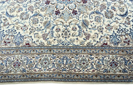 Corner detail of 2000s Nain rug showing border pattern and Wool pile