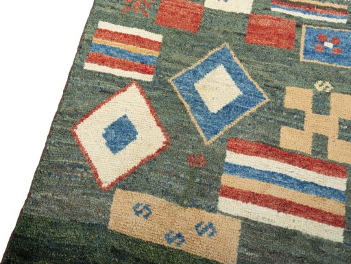 Backside of handmade 2000s Persian Gabbeh rug showing knot structure and weave density