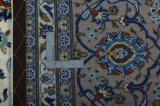 Backside of handmade 2000s Kashan rug showing knot structure and weave density