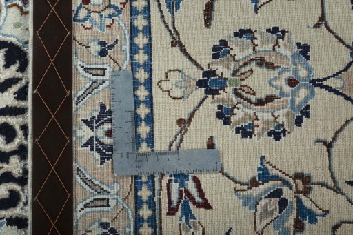 Backside of handmade New Nain rug showing knot structure and weave density