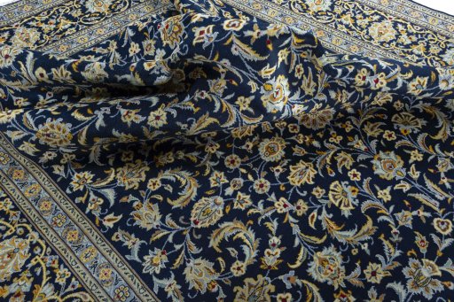 Surface texture of 2000s Kashan rug with natural Wool and intricate pattern