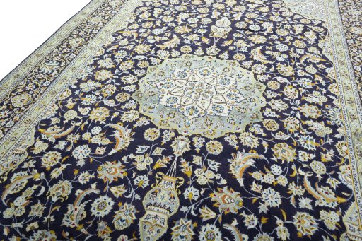 Backside of handmade 2000s Kashan rug showing knot structure and weave density