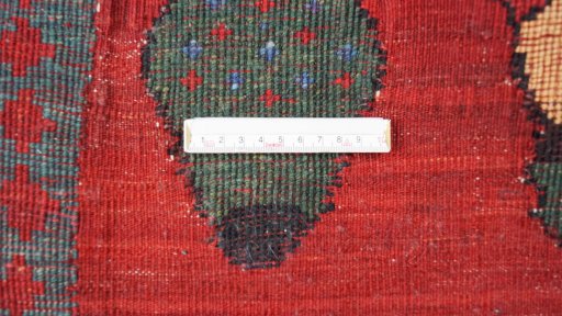 Backside of handmade New Kilim Gabbeh rug showing knot structure and weave density