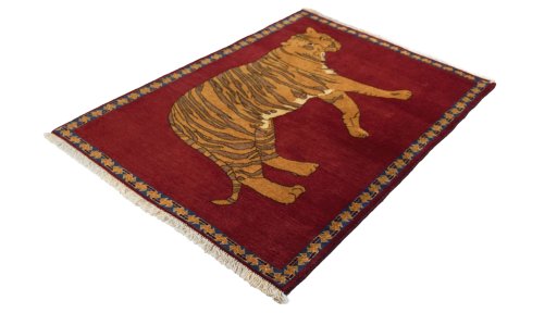 Corner detail of 1980s Persian Gabbeh rug showing border pattern and Wool pile