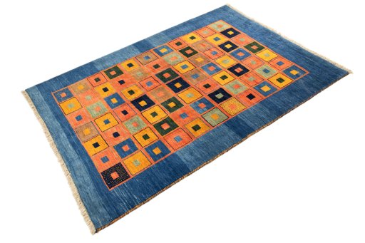 Corner detail of 2000s Persian Gabbeh rug showing border pattern and Wool pile