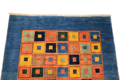 Surface texture of 2000s Persian Gabbeh rug with natural Wool and intricate pattern