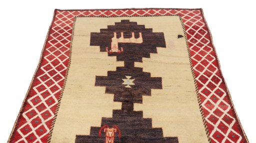 Surface texture of 1920s Persian Gabbeh rug with natural Wool and intricate pattern