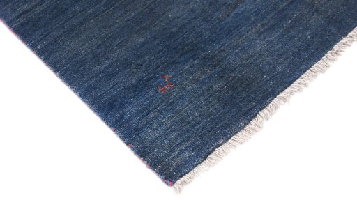Backside of handmade 1980s Persian Gabbeh rug showing knot structure and weave density