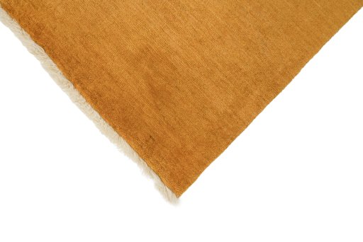 Backside of handmade New Persian Gabbeh rug showing knot structure and weave density