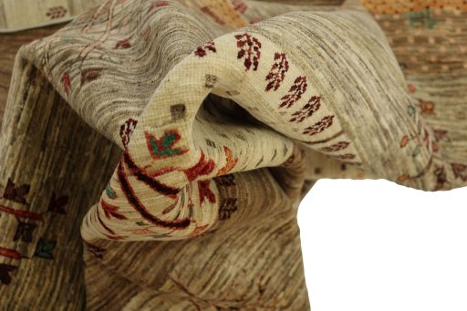 Backside of handmade New Persian Gabbeh rug showing knot structure and weave density