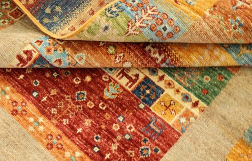 Corner detail of New Persian Gabbeh rug showing border pattern and Wool pile