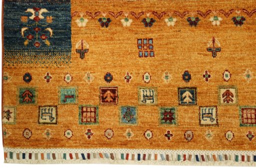 Corner detail of New Persian Gabbeh rug showing border pattern and Wool pile