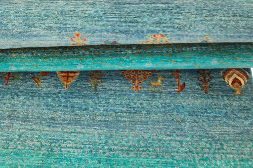 Corner detail of New Persian Gabbeh rug showing border pattern and Wool pile