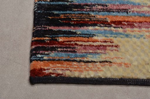 Backside of handmade New Persian Gabbeh rug showing knot structure and weave density