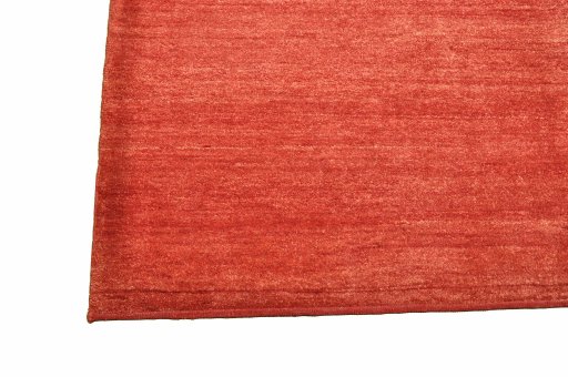 Backside of handmade New Persian Gabbeh rug showing knot structure and weave density