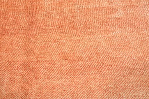 Backside of handmade New Persian Gabbeh rug showing knot structure and weave density