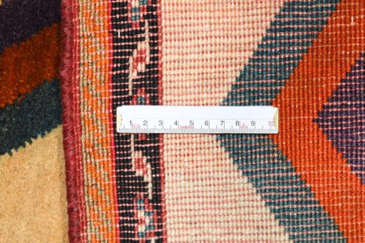 Corner detail of 2000s Persian Gabbeh rug showing border pattern and Wool pile