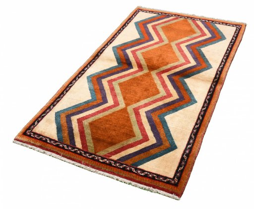 Corner detail of 2000s Persian Gabbeh rug showing border pattern and Wool pile