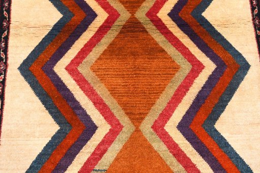 Surface texture of 2000s Persian Gabbeh rug with natural Wool and intricate pattern