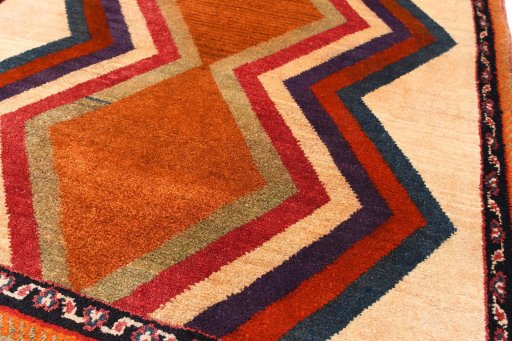 Backside of handmade 2000s Persian Gabbeh rug showing knot structure and weave density
