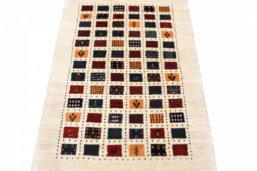 Surface texture of 2000s Persian Gabbeh rug with natural Wool and intricate pattern