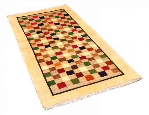 Corner detail of 2000s Persian Gabbeh rug showing border pattern and Wool pile