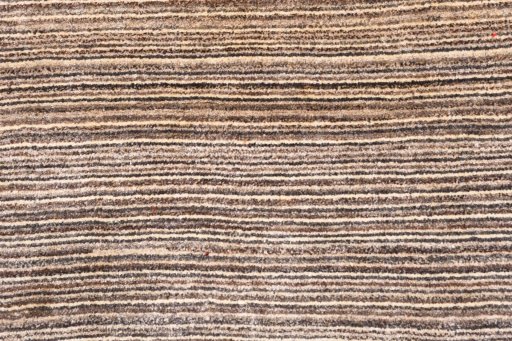 Backside of handmade 2000s Persian Gabbeh rug showing knot structure and weave density