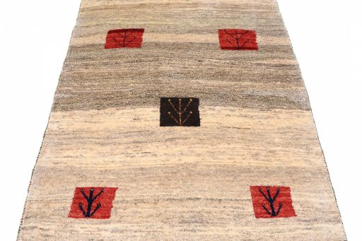 Surface texture of 2000s Persian Gabbeh rug with natural Wool and intricate pattern