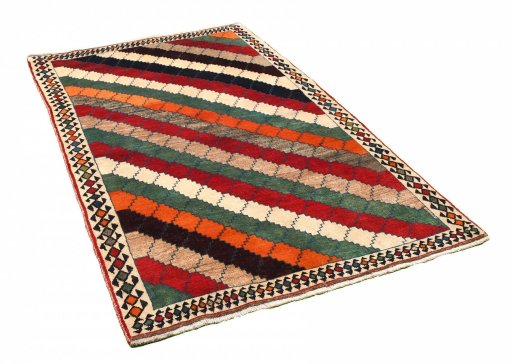 Corner detail of 2000s Persian Gabbeh rug showing border pattern and Wool pile