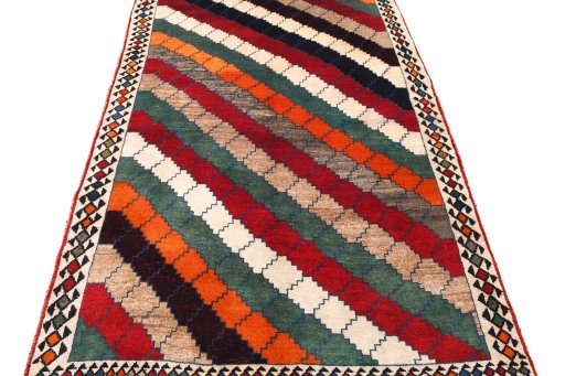 Surface texture of 2000s Persian Gabbeh rug with natural Wool and intricate pattern