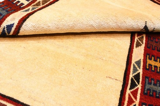 Corner detail of 2000s Persian Gabbeh rug showing border pattern and Wool pile