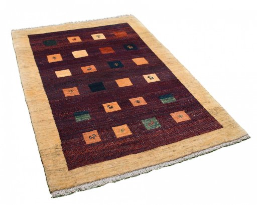 Corner detail of 2000s Persian Gabbeh rug showing border pattern and Wool pile