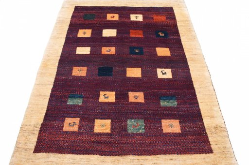 Surface texture of 2000s Persian Gabbeh rug with natural Wool and intricate pattern