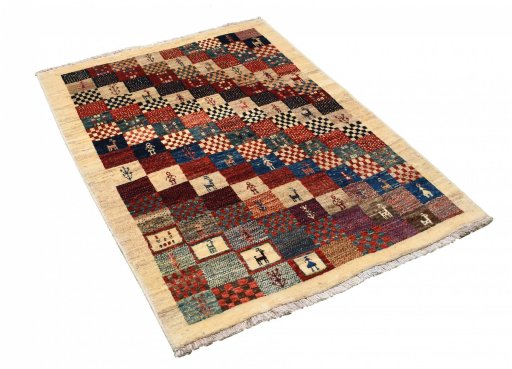 Corner detail of 2000s Persian Gabbeh rug showing border pattern and Wool pile