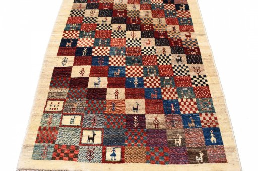 Surface texture of 2000s Persian Gabbeh rug with natural Wool and intricate pattern