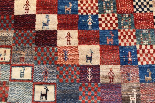 Backside of handmade 2000s Persian Gabbeh rug showing knot structure and weave density