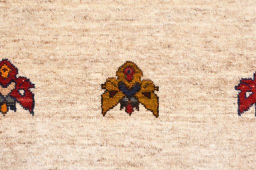 Backside of handmade 2000s Persian Gabbeh rug showing knot structure and weave density