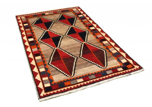Corner detail of 2000s Persian Gabbeh rug showing border pattern and Wool pile