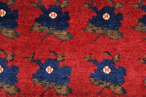 Surface texture of 2000s Persian Gabbeh rug with natural Wool and intricate pattern