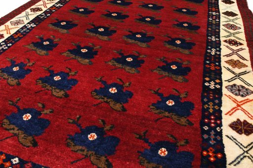 Backside of handmade 2000s Persian Gabbeh rug showing knot structure and weave density
