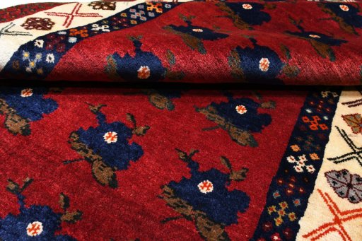 Full view of 2000s Persian Gabbeh rug from Iran / Persia, 175 × 115 cm in Red tones