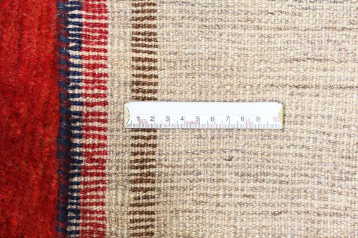 Surface texture of 2000s Persian Gabbeh rug with natural Wool and intricate pattern