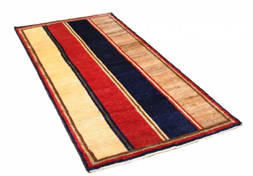 Corner detail of 2000s Persian Gabbeh rug showing border pattern and Wool pile