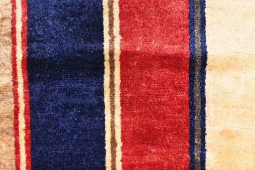 Backside of handmade 2000s Persian Gabbeh rug showing knot structure and weave density